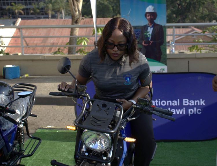 NBM plc Relationship Manager Rachel Chirambo testing the e bike 002