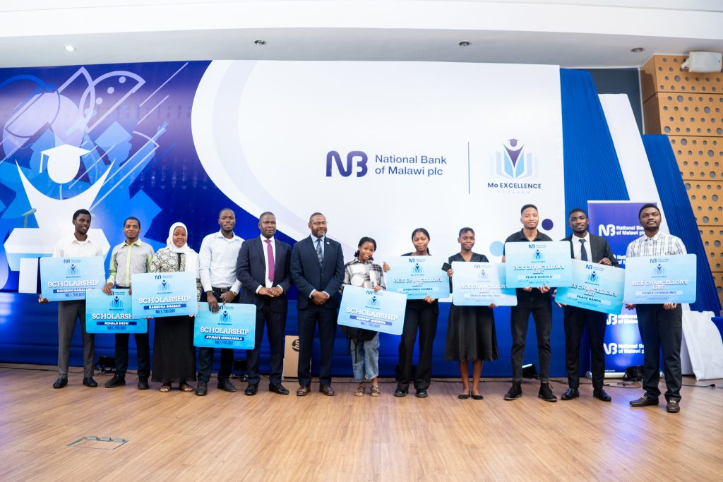 Scholarship-program-beneficiaries-and-Vice-Chancellor-list-award-winners-posing-for-a-picture-with-Jiya-and-Mallewa-