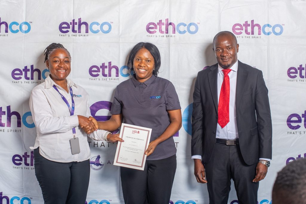 EthCo launches peer counselling programme for employees | Malawi Freedom Network Chakaniza left presents a certificate to Ella Chimbalanga centre as Mhone looks on