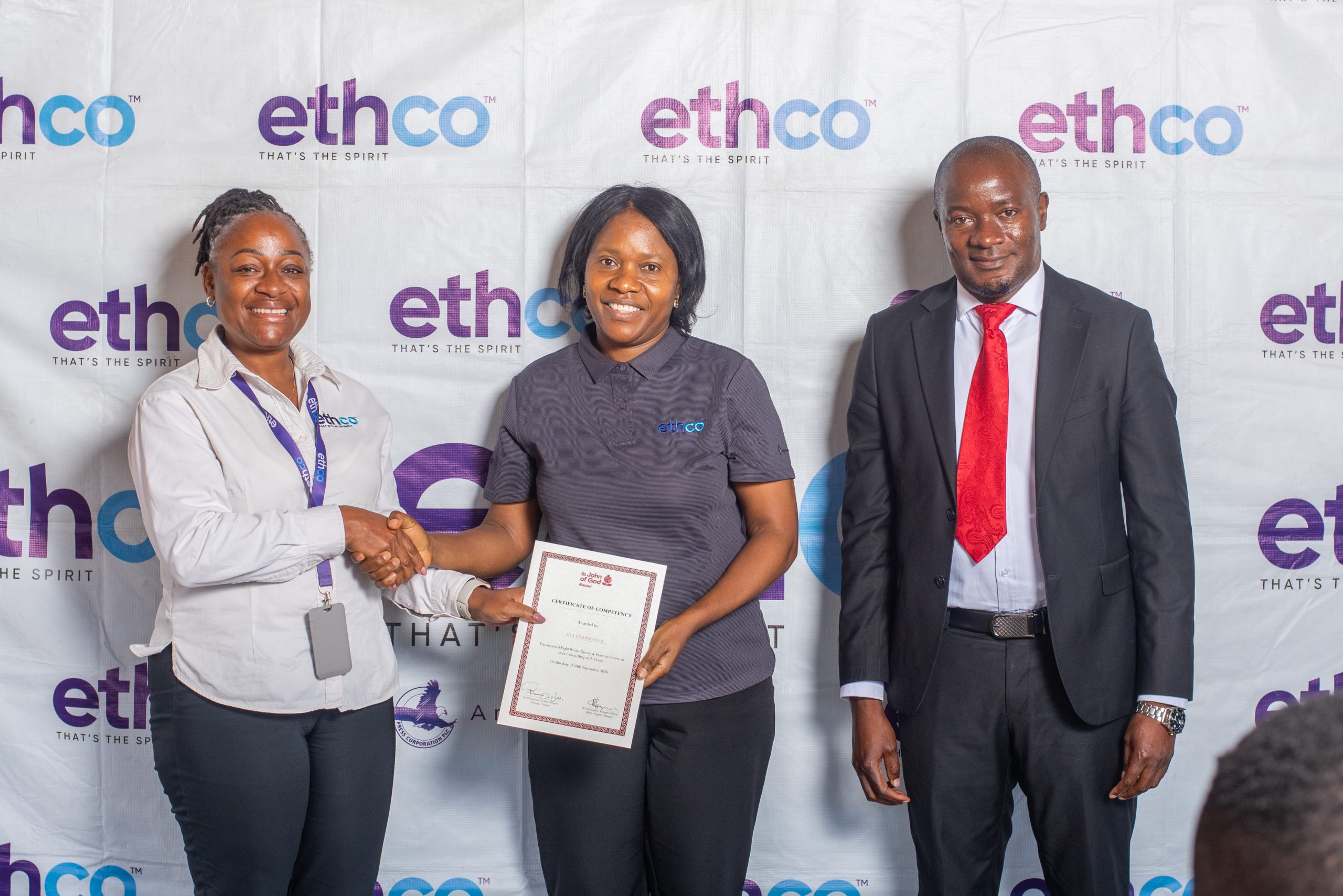 Chakaniza left presents a certificate to Ella Chimbalanga centre as Mhone looks on