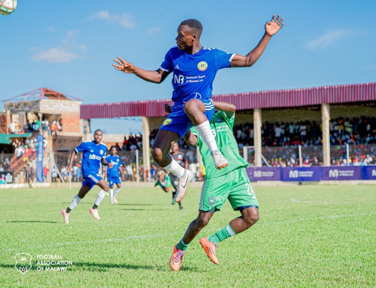 Karonga United Reserve clears the ball from Mponela FC during last seasons final