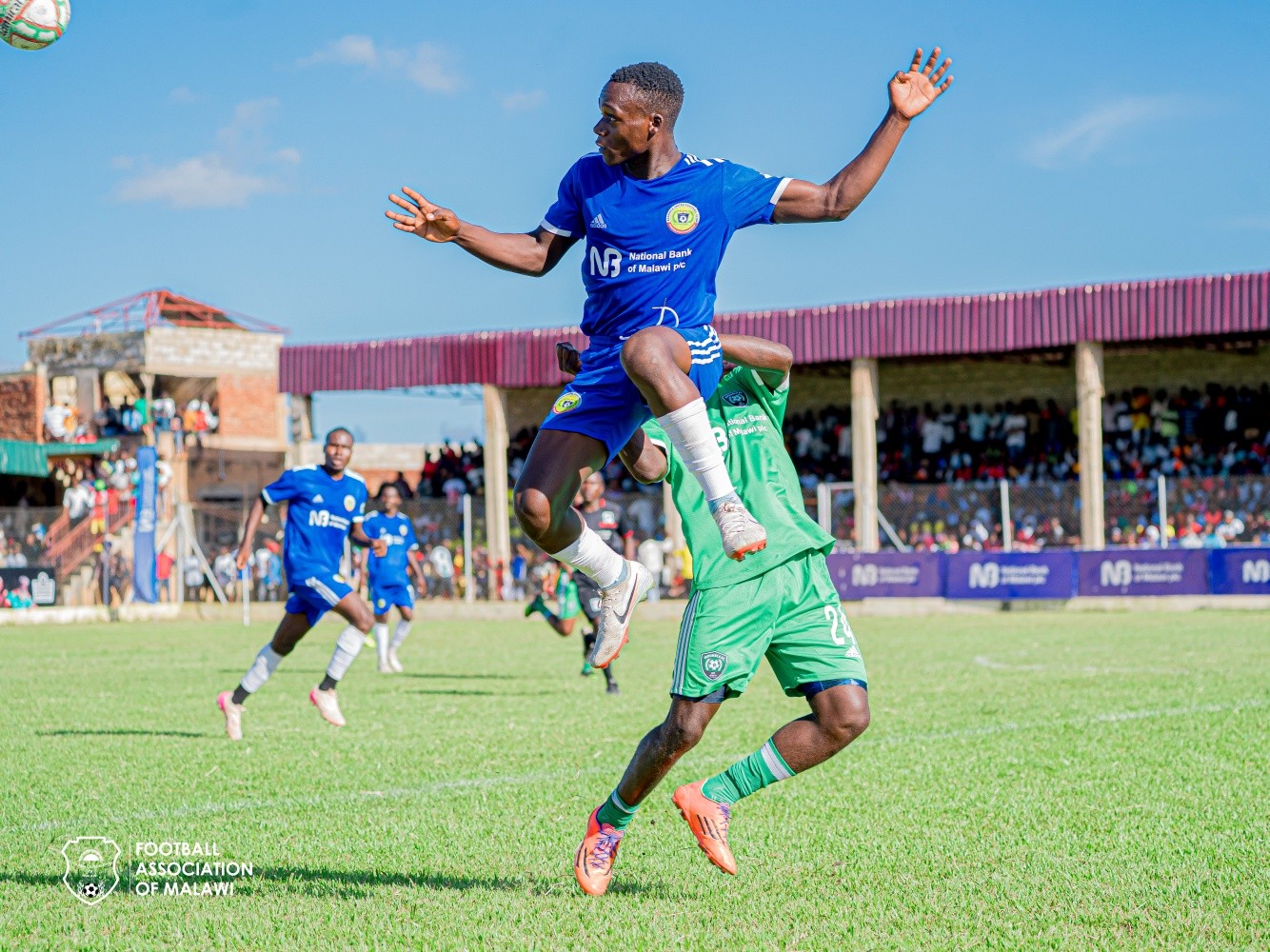 Karonga United Reserve clears the ball from Mponela FC during last seasons final