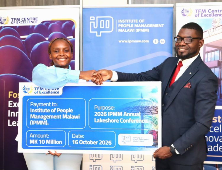 Nseula Left handing over the cheque to Chakhoma 002