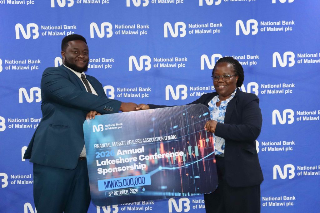 NBM plc supports FMDA conference with K5 million | Malawi Freedom Network Phiri right hands over a cheque to Chikagwa 002