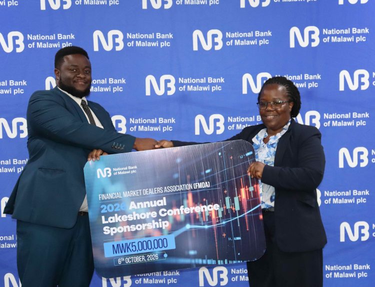Phiri right hands over a cheque to Chikagwa 002