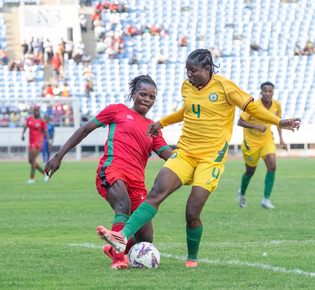 NBM Plc impressed with Scorchers’ winning start to Olympic qualifiers | Malawi Freedom Network Scorchers player Asimenye Simwaka battling it out with Zimbabweans mighty warriors player Egness Tumbare 002