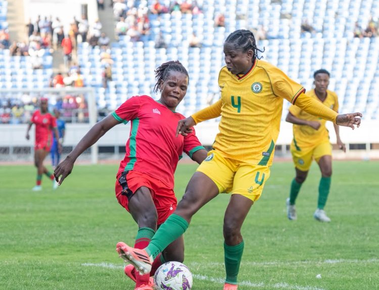 Scorchers player Asimenye Simwaka battling it out with Zimbabweans mighty warriors player Egness Tumbare 002