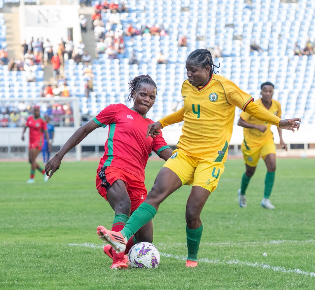 Scorchers player Asimenye Simwaka battling it out with Zimbabweans mighty warriors player Egness Tumbare 002
